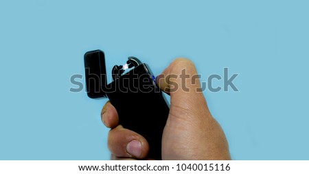 Electric lighter with hand