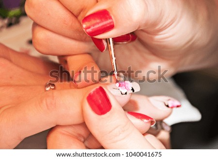 Manicure. Drawing a picture on a nail