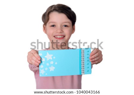 Beautiful handmade card in girl's hands, place to insert your text or picture. Paper craft skills, art lesson in elementary school.