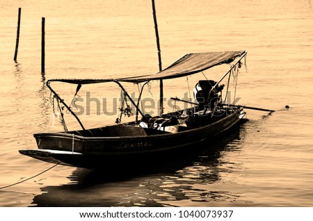 Boat for fishing on the lake. Vintage photo
