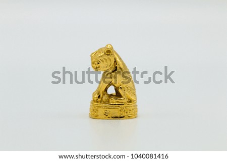 Little golden tiger, isolated on white background ,Thailand amulet symbolic