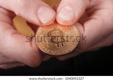 Bitcoin monet close up in hand. crypto-currencies. Business concept