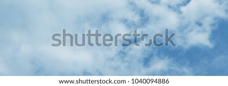 White clouds in the blue sky. Nature and environment. Background with clouds. Can be used as a header or banner on your website, blog or social media.
