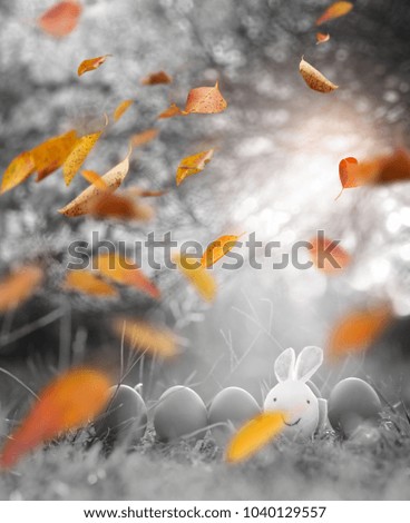 Rabbit and colorful Easter eggs in nature.Easter concept background.