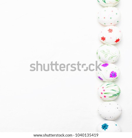 White easter eggs with a hand-drawn pencil pattern, white background, top view