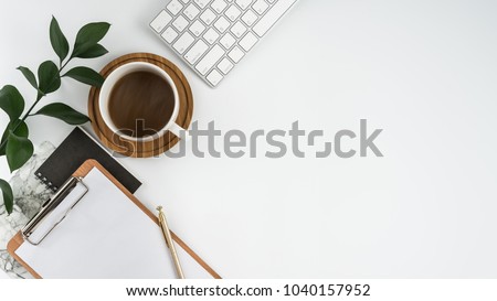 Styled stock photography white office desk table with blank notebook, computer, supplies and coffee cup. Top view with copy space. Flat lay. Royalty-Free Stock Photo #1040157952