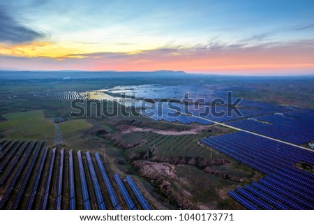 Aerial Solar PV panels outdoors at sunrise