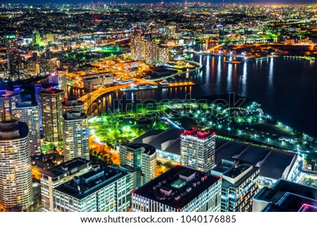 Asia Business concept for real estate and corporate construction - panoramic modern city skyline aerial night view of Yokohama pier under deep blue sky in Yokohama, Japan