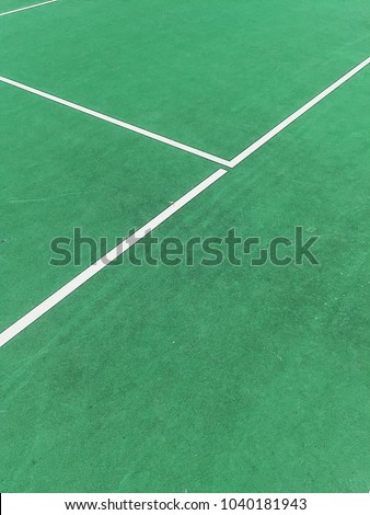 Colorful green tennis court at sunny day