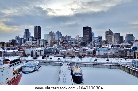 Aerial View of Snow-Covered Montreal (Downtown), Frozen Harbour, and Ships in Winter - Montreal, Canada