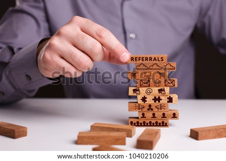 The concept of technology, the Internet and the network. Businessman shows a working model of business: Referrals Royalty-Free Stock Photo #1040210206