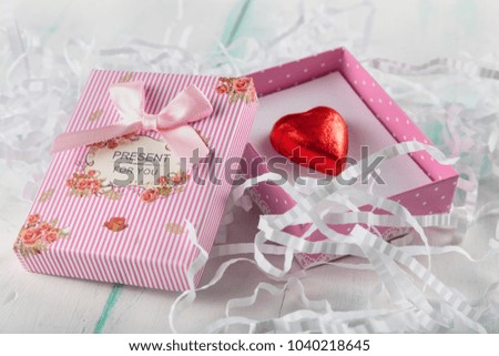 beautiful miniature striped gift box with lettering and bow