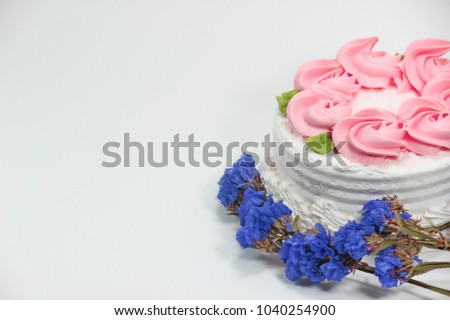  Lovely cream cake and white background Royalty-Free Stock Photo #1040254900
