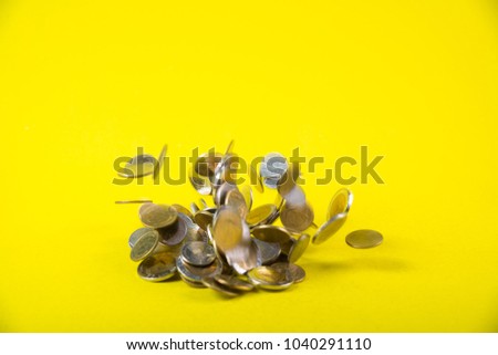 Falling coins money on yellow background, business wealth concept idea.