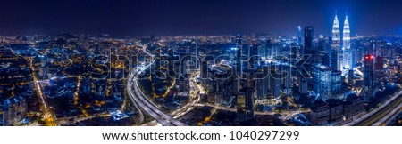 Panorama aerial view of Kuala Lumpur City center at night dusk.  Royalty-Free Stock Photo #1040297299