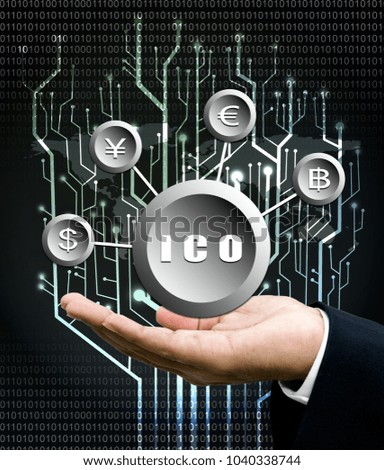Businessman hand carry ICO symbol, Initial Coin Offering, icon on a virtual screen. Cryptocurrency, Bitcoin and ICO Digital Electronic Trade Market Stock Index concept.