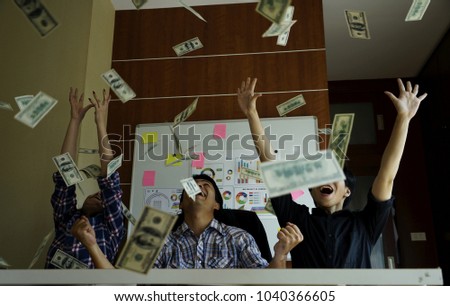 Business team partner celebrating profit by throwing money. Happy man enjoying the rain of money, Hand receiving money, US dollars, from business man, Rich with success.