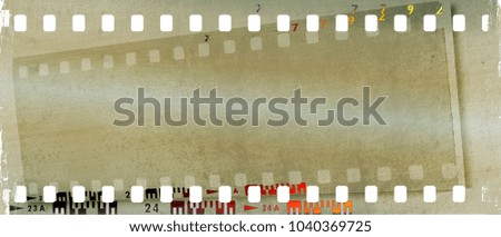 Grunge double film strip frame in sepia tones.