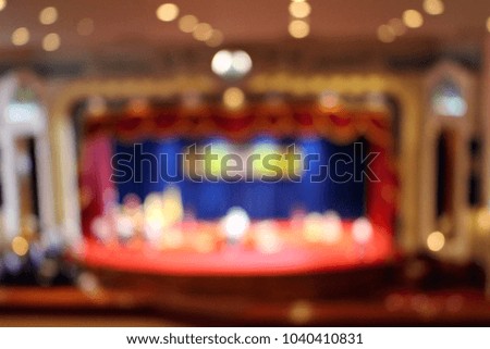 Blurred background of a theater stage with light bokeh effect