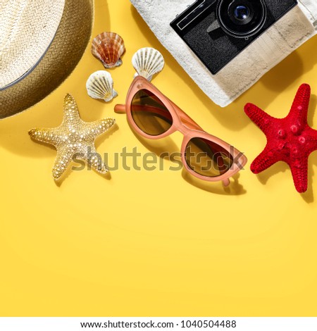 Summer photo of travel tools on yellow background and free space for your decoration. 