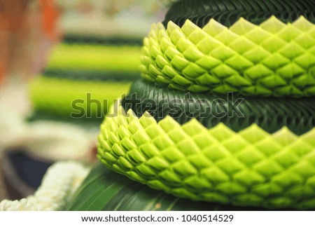 Close up Green Lotus petal and banana leafs in the Thai's style worship for Teacher. This picture have space on the left for text. Beautiful for card design or background
