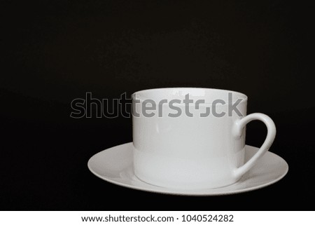 White cup, mug, glass for drinking coffee, chocolate, coco, sweet isolated on black background for easy cut and paste in any design works or productions.