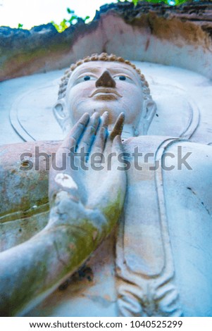 Carving Buddha art on rock in Huai Pha Kiang temple, Thailand.