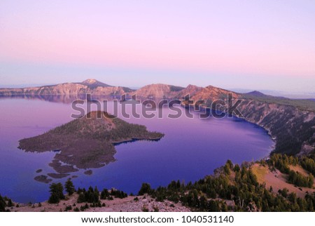 A beautiful view of Crater Lake at sunset in summer in Oregon state USA