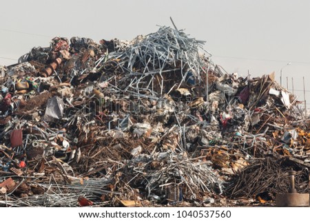 Heap of scrap metal ready for recycling. Junkyard
