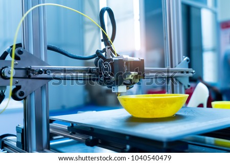 3D printer printing figure close-up macro Royalty-Free Stock Photo #1040540479