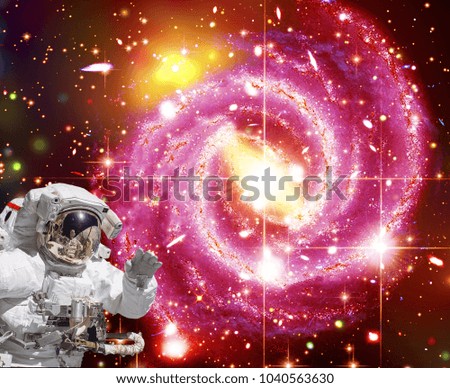 Astronaut waves. Waving in space. The elements of this image furnished by NASA.