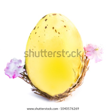 Easter eggs in a wicker nest on white wooden background with  copy space.  Festive decoration. Happy Easter!
