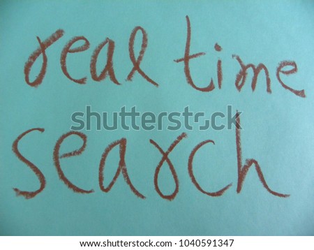 Text real time search hand written by brown oil pastel on blue color paper