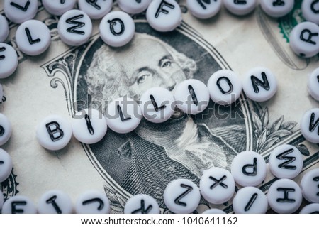 Word BILLION made from small white letters on dollar background  