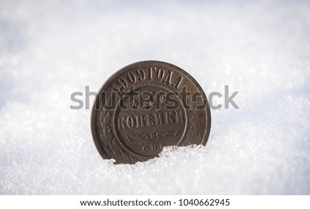 The coin is in winter in the snow