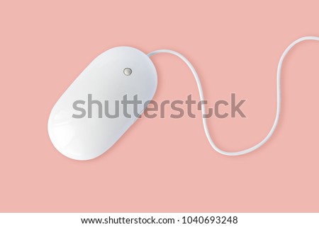 Simple white computer mouse with cord isolated on pastel pink background, minimal style Royalty-Free Stock Photo #1040693248