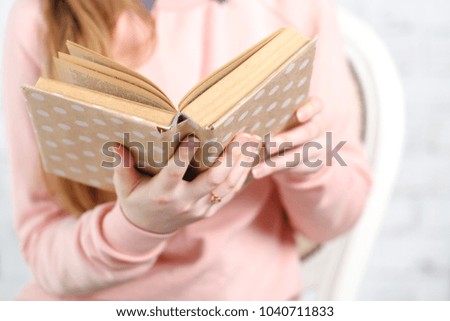 Soft photo of woman with old book
