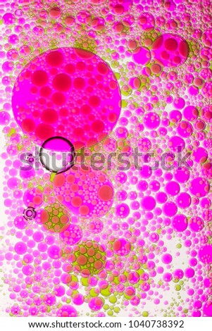 Abstract  macro view of colored oil drops in water
