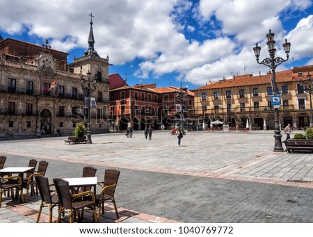 A sunny afternoon at Plaza Mayor in Leon, Spain. Tables and chairs arranged for al fresco dining. Royalty-Free Stock Photo #1040769772