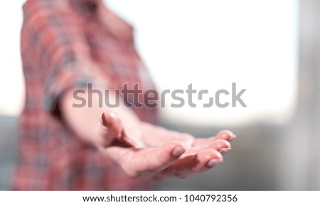 Hand of woman in gesture of support, selective focus