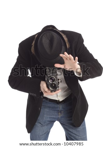 Man taking a picture with an old style film camera