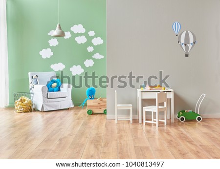 grey and green wall decoration modern baby room and all kind of baby object in the room. bed cabinet and toys style