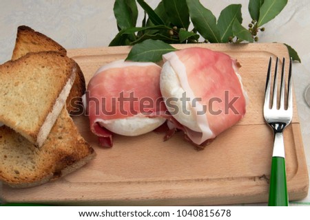 Typical italian cheese: Tomino with speck ham.