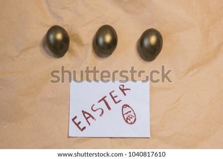 Easter. golden eggs. eggs with a feather. good easter. The inscription on white and on a purple background. Easter eggs. Easter pictures.
