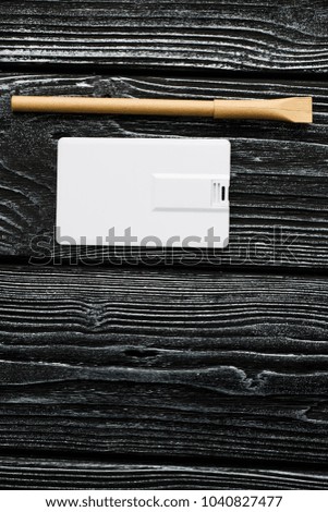 Photo of blank stationery set on wood background. Envelope, business cards, pen usb flash card. Corporate identity template. Responsive design mockup.