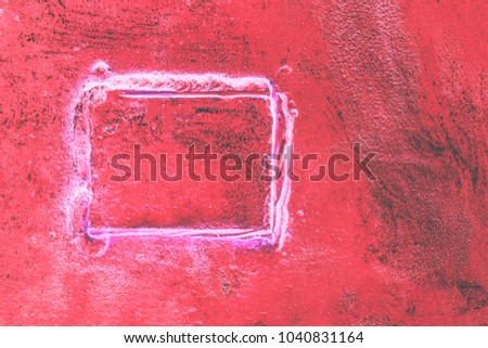 Painted in pink-red color wall. Texture of a dirty iron wall. Divide the paint on a flat metal surface. Square space for text.