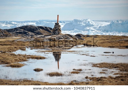 Greenland. The picturesque village of Ilulissat is comfortably located near a beautiful glacier