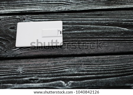 Photo of blank usb flash card cards. Blank usb flash card on wooden table background. Template for ID. Mockup for branding identity.