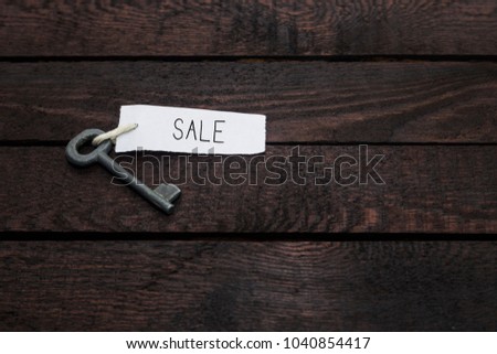 key with inscription SALE