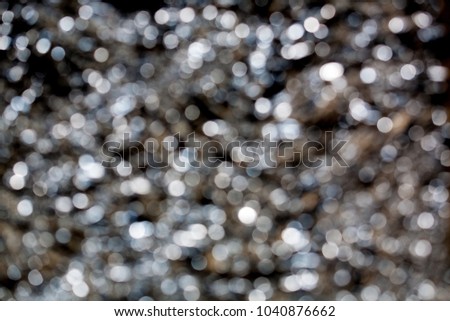 Sparkling spots of Bokeh - a metal surface is not in focus, the background, metal, blue tint

